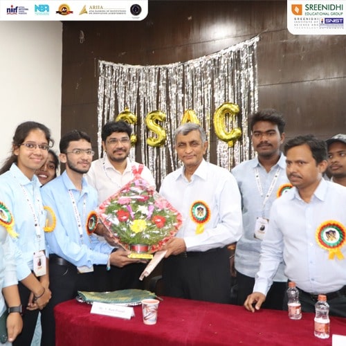 Dr Jayaprakash Narayana with Civil Services Academy Club members, including Professor Ram Prasad, being welcomed with a bouquet.